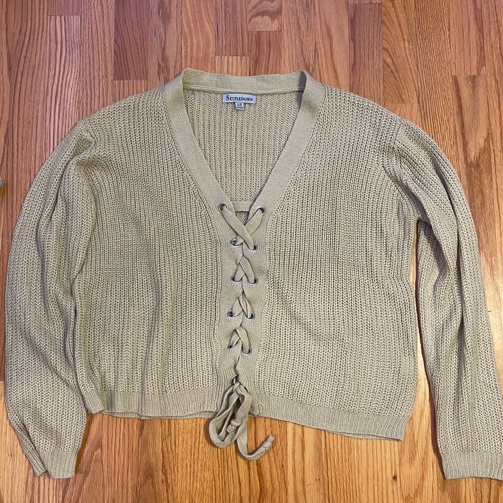 beige sweater in a small/medium